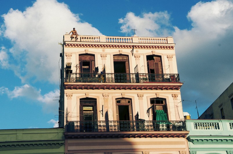 "A man sits on a roof ledge in Havana." / photo by Natalie Morales